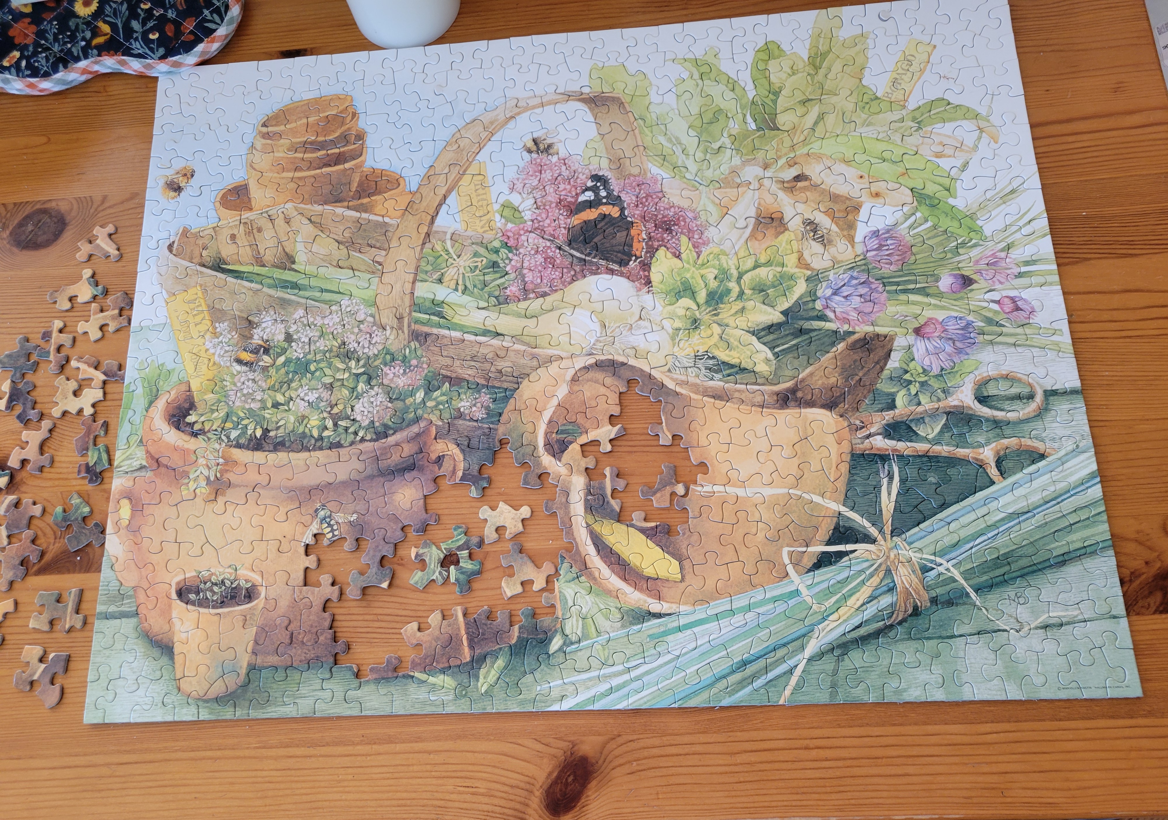 puzzle picture of plants and butterflies among broken pots