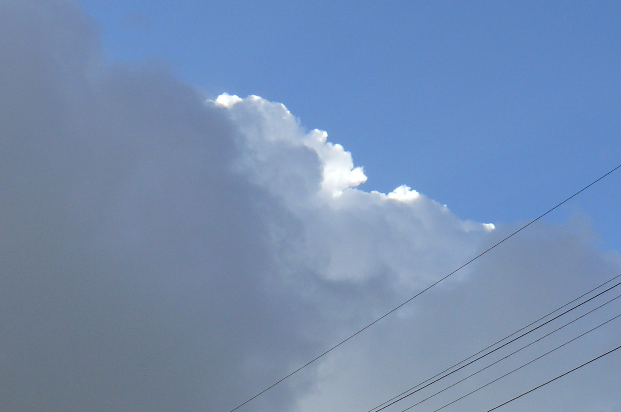 dark and light clouds blue sky